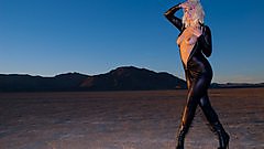 Lynn Pops in her leather cat suit in the desert.